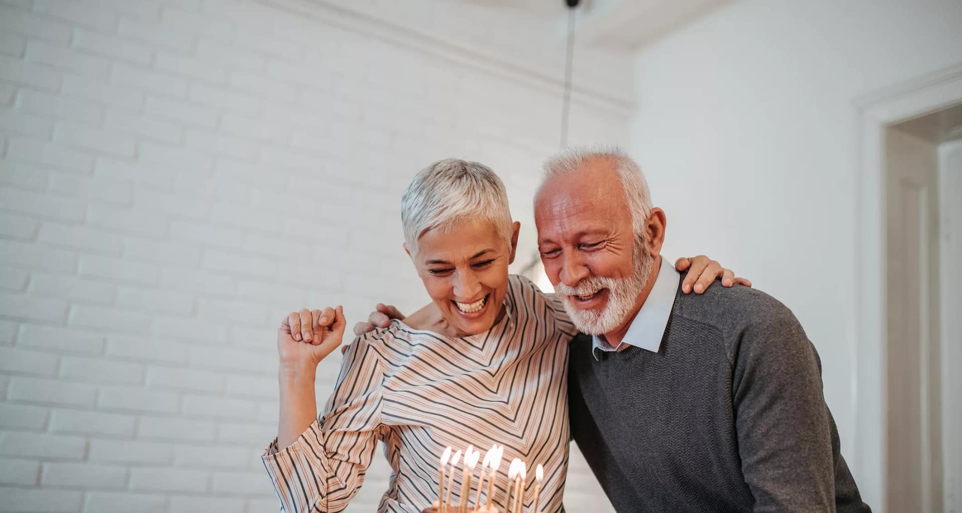 senior couple birthday cake gettyimages .jpg