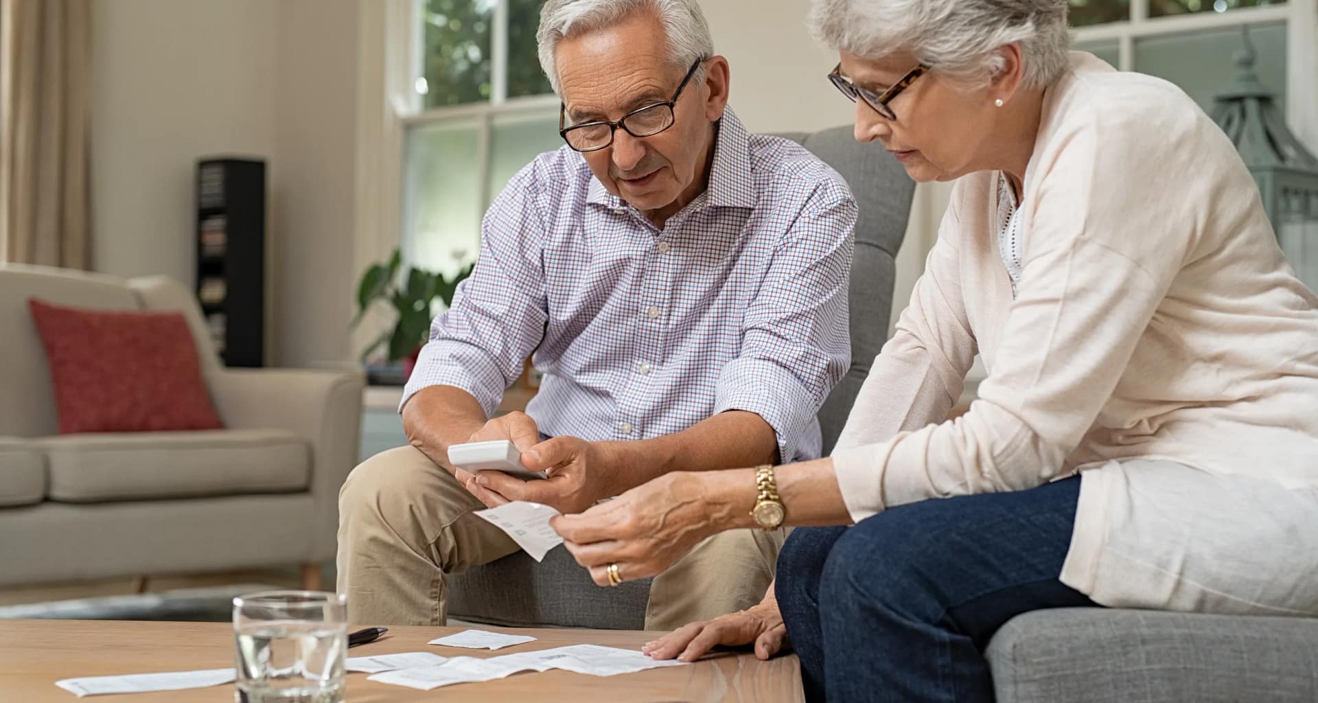 retired couple looking at financial paperwork.jpg