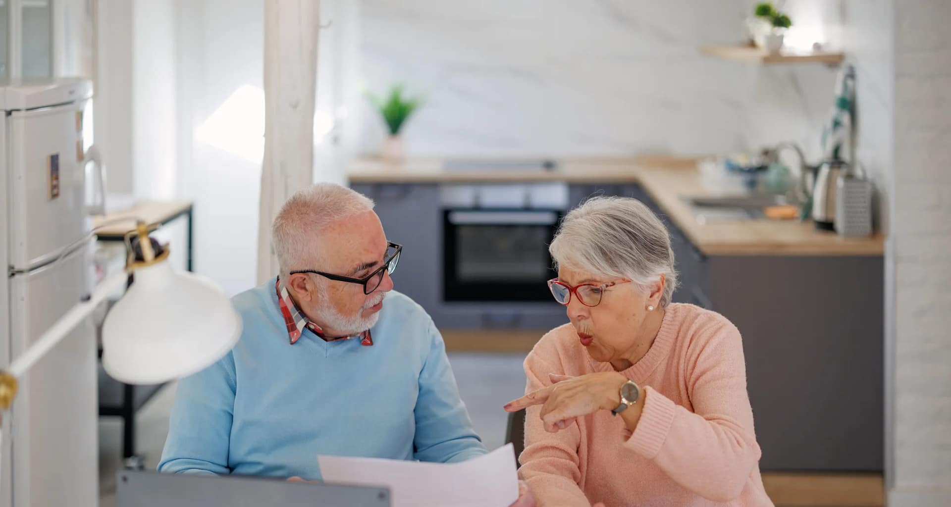 senior couple at a desk serious gettyimages .jpg