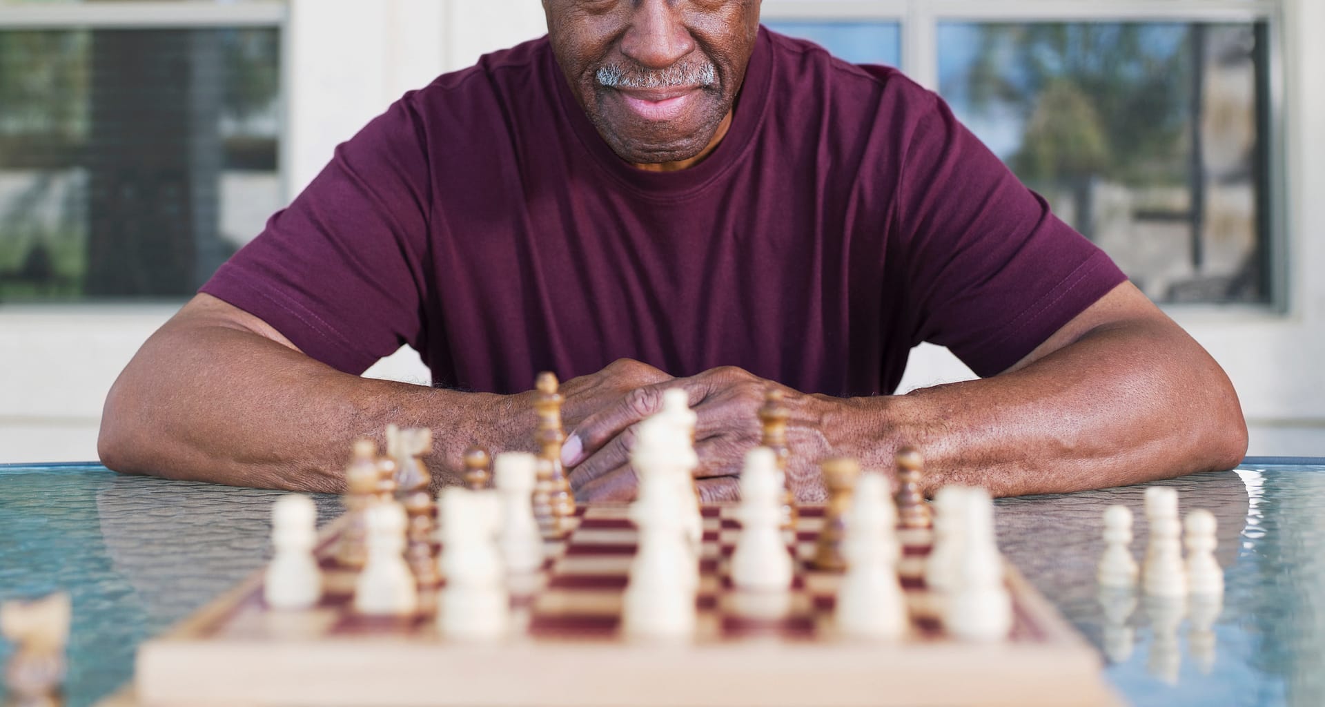 getty older man playing chess strategy moves winning.jpg