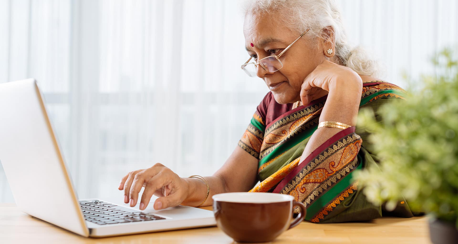 serious senior staring at laptop.jpg