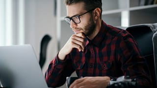 man s at desk serious gettyimages