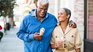 getty happy couple outdoors with ice creams
