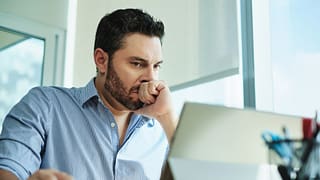 man in s desk serious nervous gettyimages