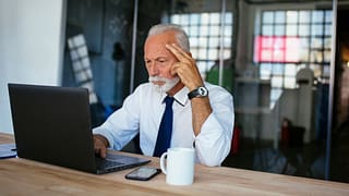 older man laptop serious gettyimages