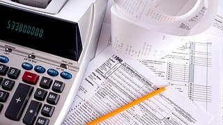 gettyimages adding machine taxes