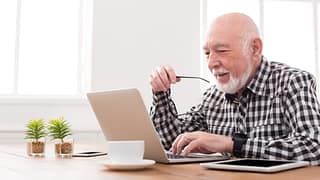 older man at laptop gettyimages