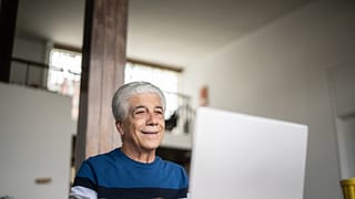 senior laptop smiling gettyimages