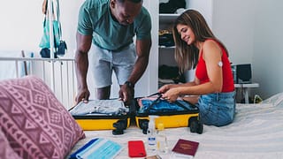 Couple packing for vacation lrtJl.width .jpg