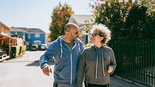 Couple walking in neighborhood of gated commu.width SuvQq.jpg