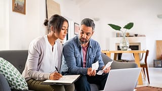Couple working on taxes. ncVJUD.width