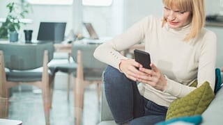 Woman uncomfortable by what shes reading on h.width InPJRqv