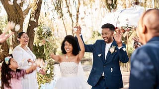 bride and groom cheering at wedding arpIRny.width