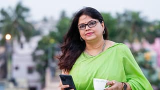 drinking tea and using her smartphone.jpg