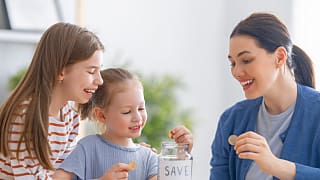 family saving money kids piggybank
