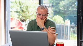 man s laptop by window gettyimages