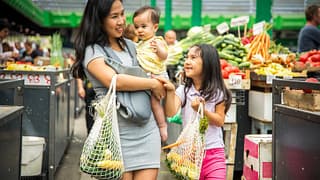 mom with kids in produce grocery store yxKb.width .jpg