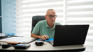 older man desk serious gettyimages