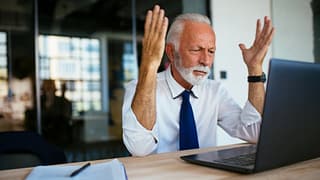 older man laptop annoyed gettyimages