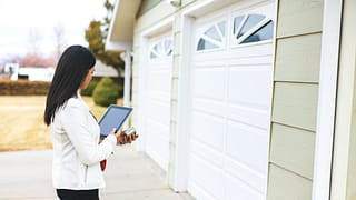 person appraising garage of home ywtXvs.width .jpg