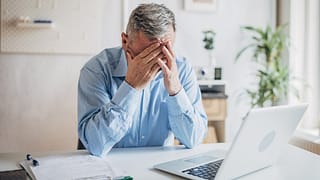 senior man laptop covering face gettyimages