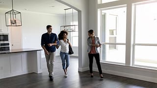 two people viewing house with realtor uSgcB.width .jpg