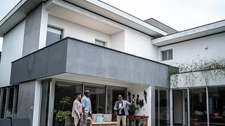 two people with realtor looking at pool rml.width