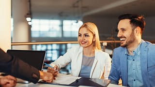 Couple signing contract HdgFNU.width .jpg