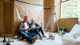 Couple sitting relaxing in a room thats under.width tylU.jpg