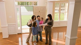 Family touring home with realtor ETEsAgi.width .jpg