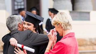 Female college grad hugging dad XOFFTxD.width .jpg