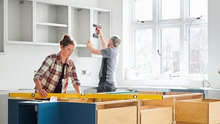 Man and woman working on a kitchen remodel TD.width .jpg
