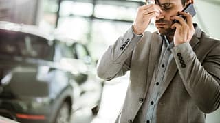 Man in apparent distress on phone with vehicl.width .jpg