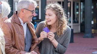 Parents giving credit card to excited teen da.width FXkOfK.jpg