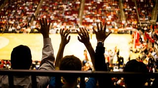 Spectators inside a basketball arena QOanBmo.width .jpg