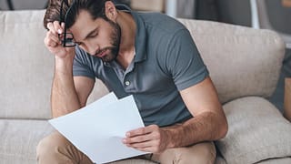 Upset man with bills wEKVP.width .jpg