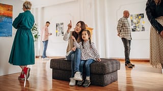 Woman and daughter looking at art in a museum.width deOwmAd.jpg