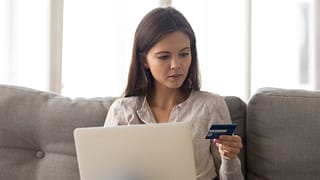 Woman with credit card laptop XrheSHb.width .jpg
