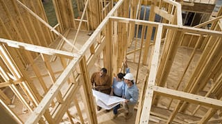 couple with architect in house under construc.width RSmacdW.jpg