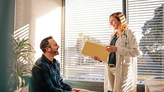 doctor with patient in office.width .jpg