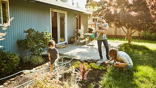 family in backyard garden PRMOWmx.width .jpg