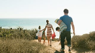 family walking to beach dcUQs.width .jpg