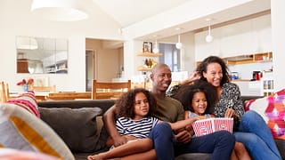 family watching movie on couch.width .jpg