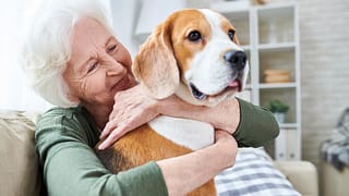happy granny loving her dog in retirement.jpg