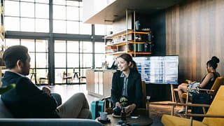man and woman in airport lounge rQqosD.width .jpg