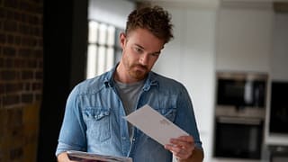 man opening mail envelopes iBuuR.width .jpg