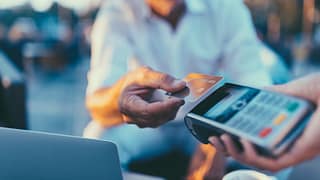 man paying with credit card OWFbgs.width .jpg