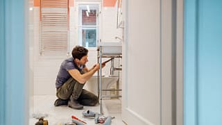man repairing sink FHYp.width .jpg