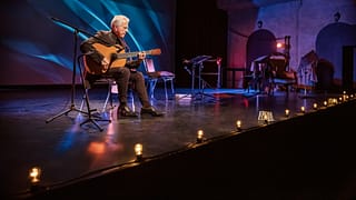 older man guitar stage gettyimages .jpg