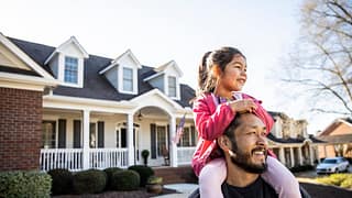 parent and child in front of house gnkEfq.width .jpg